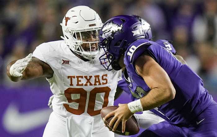 Texas Longhorns defensive lineman Byron Murphy II (90) sacks TCU Horned Frogs quarterback Josh Hoover (10). © Ricardo B. Brazziell/American-Statesman / USA TODAY NETWORK